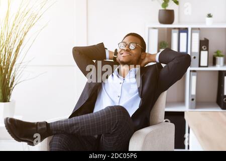 Relaxed black businessman resting in his office Stock Photo