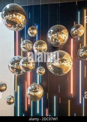 Many Retro Disco Balls Rotating in Discoteque Stock Photo