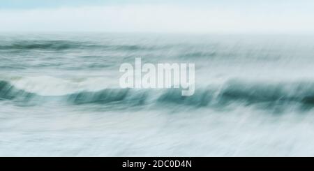 Intentional camera movement of ocean wave, abstract blurred sea background Stock Photo