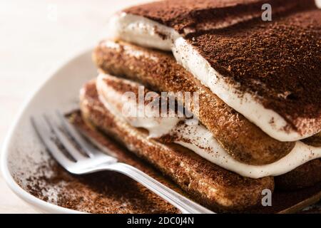 Traditional tiramisu cake on wooden table Stock Photo