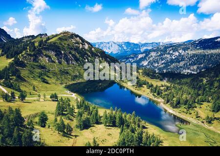 Tauplitz Alm. Lake Großsee and Lawinenstein peak mountain in Styria during summer. Stock Photo