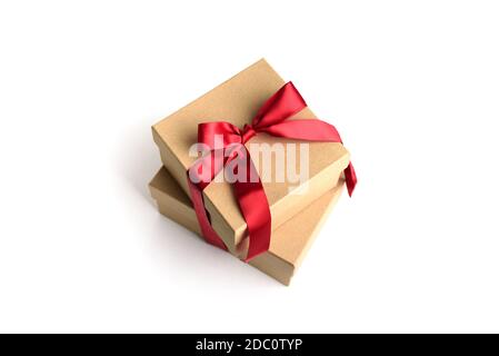Two craft gift boxes with red ribbon bow. Stock Photo