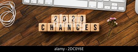 cubes with message 2020 CHANCES with computer keyboard on wooden background Stock Photo