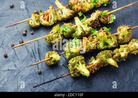 Vegetable kebab from broccoli cabbage.Fried cabbage on wooden skewers Stock Photo