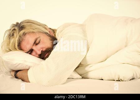 Having nap. Sweet dreams. Hipster with beard fall asleep. Good night. Mental health. Practice relaxing bedtime ritual. Man with sleepy face lay on pillow. Fast asleep concept. Man with beard relaxing. Stock Photo