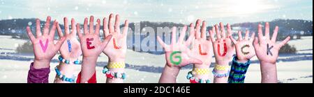 Kids Hands Holding Colorful German Word Viel Glueck Means Good Luck. Snowy Winter Background With Snowflakes Stock Photo