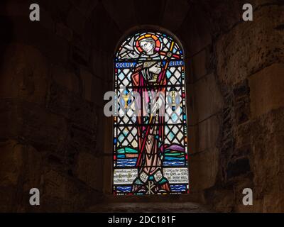 St Columbas window inside Iona Abbey on the Isle of Iona Scotland.  Thought to be the where the famous Book of Kells was created. Stock Photo