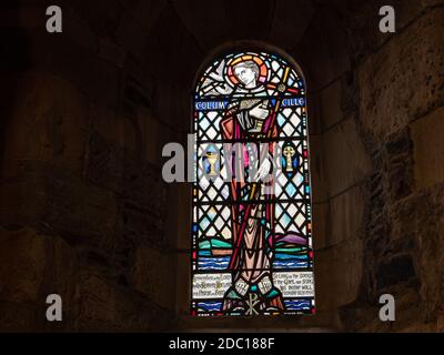 St Columbas window inside Iona Abbey on the Isle of Iona Scotland.  Thought to be the where the famous Book of Kells was created. Stock Photo