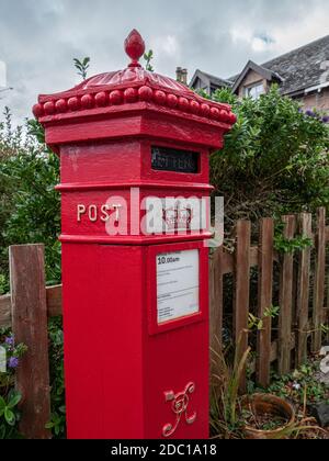 Victorian red pillar box situated on The Isle of Iona Inner Hebrides Scotland UK. Stock Photo