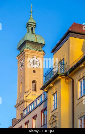 View of Heiliggeistkirche clock tower, Munich, Bavaria, Germany, Europe Stock Photo