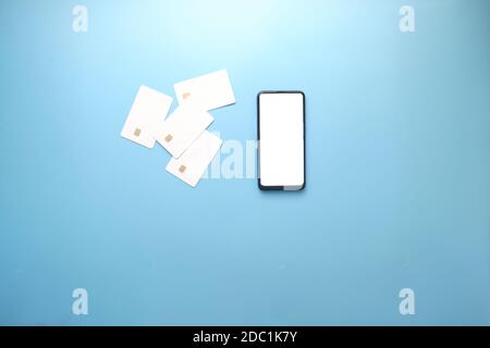 Black Friday with Sale Concept with smart phone, credit cards on blue Stock Photo
