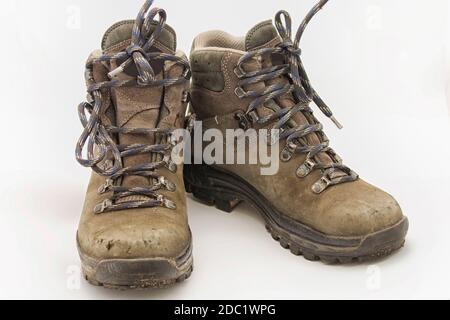 Pair of sturdy used hiking boots on white background Stock Photo