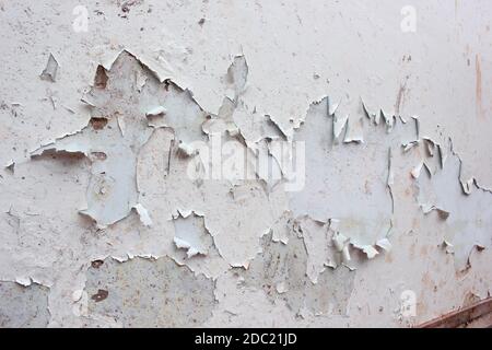 white wall with cracks, Grungy cracked white wall paint peeling off Stock Photo