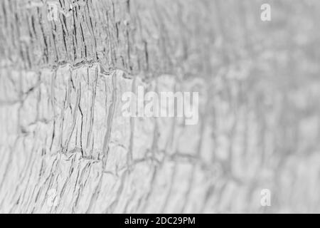 Crumpled aluminum foil texture. Shallow depth of field. Stock Photo