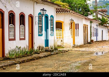 Old houses in colonial architecture and cobblestone streets in the historic city of Paraty on the southern coast of the state of Rio de Janeiro Stock Photo