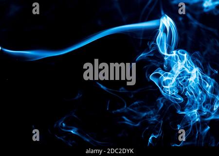multicolored smoke of pink and red colors on a black isolated background. blur stock image Stock Photo