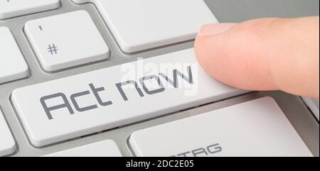 A keyboard with a labeled button - Act now Stock Photo