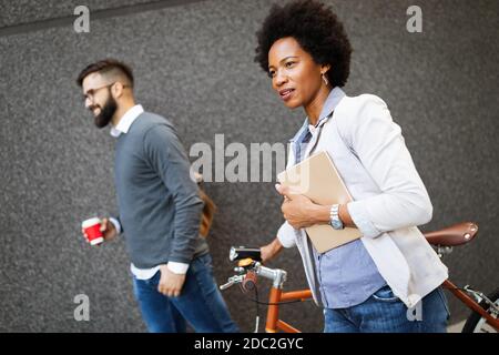 Business people on coffee break using digital tablet outdoor Stock Photo