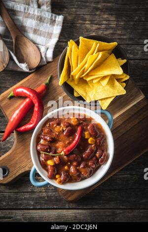 Chili con carne and tortilla chips. Mexican food with beans. Top view. Stock Photo