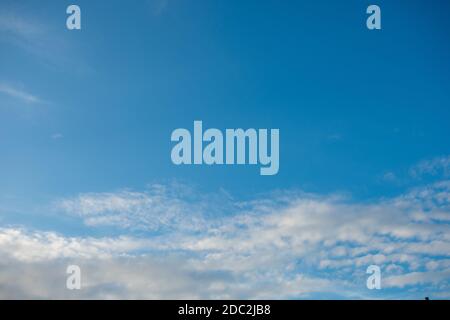 A Clear Blue Sky With Whispy Clouds on the Bottom of the Frame for Sky Replacement Stock Photo