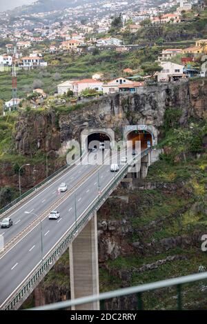 Funchal, Madeira, Portugal - April 23, 2018: Tunnel with a panorama of the city of Funchal in the background. Madeira, Portygal. Stock Photo