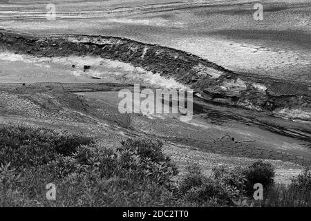 Dried bed of the Howden Reservoir in the Upper Derwent Valley in the Peak District of Derbyshire in July 2018 Stock Photo