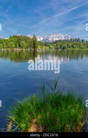 View of reflections of the Wilder Kaiser Mountains in Schwarzsee, Kitzbuhel, Austrian Tyrol, Austria, Europe Stock Photo
