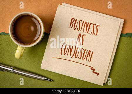 business as unusual note- handwriting on a napkin with coffee, new normal and coronavirus pandemic concept Stock Photo