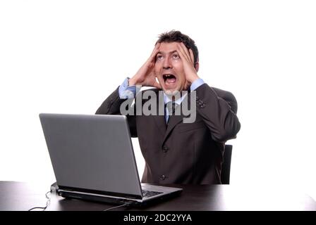 young crazy man working with is laptop Stock Photo