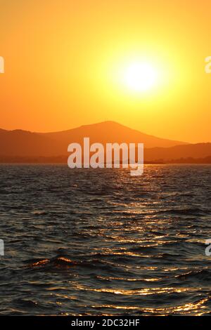 View on a orange sunset over adriatic sea with isle Pasman on background Stock Photo