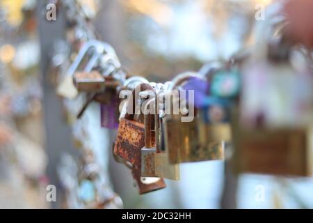 Closeup view on colorful padlocks on chain Stock Photo