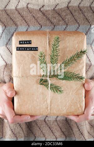 Eco gift box in craft paper branch on linen fabric. Zero waste