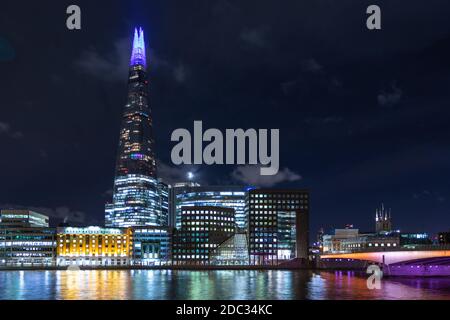 Night time view across the Thames with the Shard building and London Bridge Stock Photo