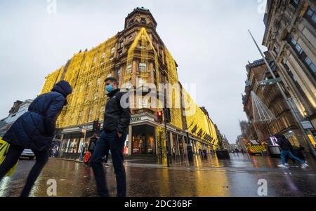 Evening view of Frasers department store with Christmas lights on Buchanan Street during rain , Glasgow, Scotland ,UK