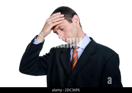 Businessman in a suit gestures with a headache Stock Photo