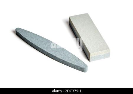 Two Sharpening stones. Grindstone or whetstone sharpener, isolated on white background. Kitchen utensils Stock Photo