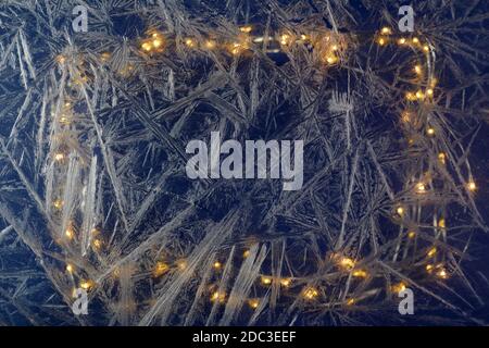 White freeze, ice crystal texture on blue background with bokeh. Stock Photo