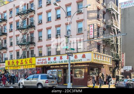 Stores and Shops Along a Busy Street in Chinatown, Manhattan. Chinese Style and Culture in the Neighborhood. New York City, USA Stock Photo