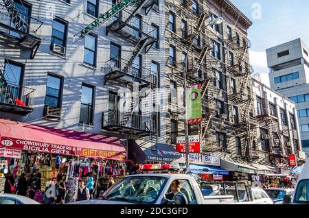 Little Italy Neighborhood in Lower Manhattan. Busy Street with Touristic Gift Shops and Traffic Jam. New York City, USA Stock Photo