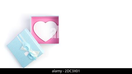 Open gift box with a white heart inside on a white background. Stock Photo