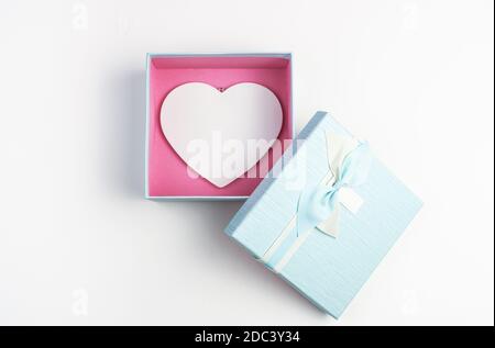 White heart in a blue box with an open lid on a white background. Stock Photo