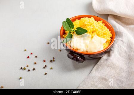 Plate Of Delicious Porridge With Corn And Melted Butter Isolated On A 