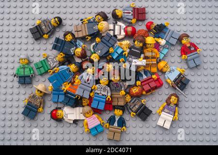 Tambov, Russian Federation - November 17, 2020 Heap of Lego minifigures on a Lego baseplate. Stock Photo