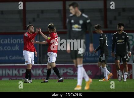 Morecambe's Ryan Cooney (left) celebrates with Freddie Price after scoring his side's first goal of the game during the Papa John's Trophy match at the Globe Arena, Morecambe. Stock Photo