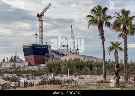 repairing a ship with the cranes of the port shipyard in the town of Burriana, Castellon province, Valencian Community, Spain, Europe Stock Photo