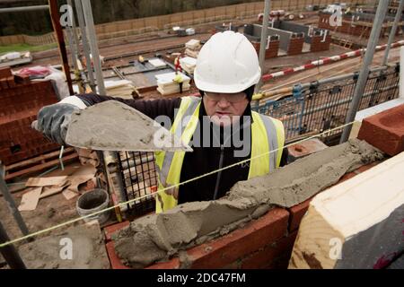 Bricklayer at work on a UK Housing Site Stock Photo