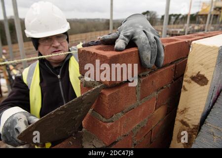 Bricklayer at work on a UK Housing Site Stock Photo