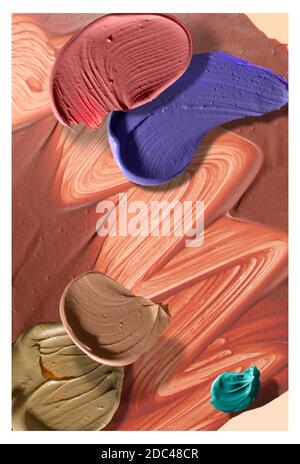 Make-up smears are layered vertically in this studio photograph.  Squiggles and other shapes fill the frame, for this concept image. Stock Photo