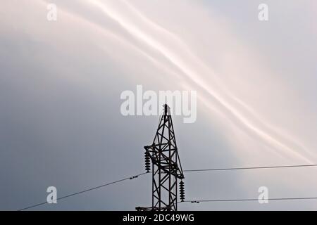 Iron electric tower on background of pre-storm sky Stock Photo