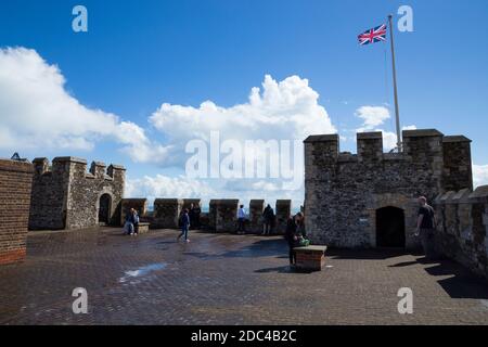The roof and corner tower with castellated walls at the top of the Great Tower of Dover Castle, Dover, Kent. UK. On the sunny summer day with blue sky and sunshine. (121) Stock Photo